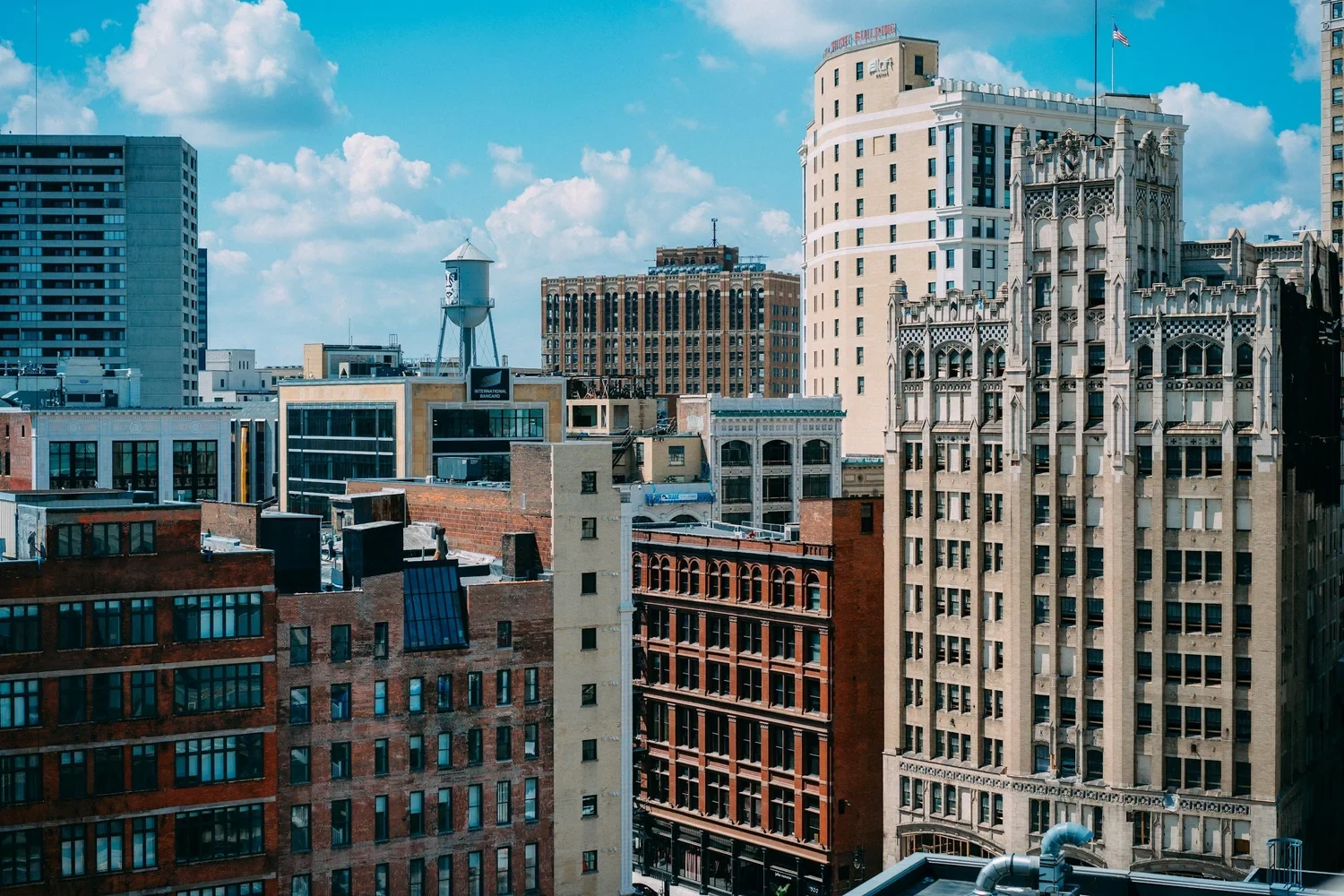 Downtown skyline of historic high-rise buildings under a blue sky